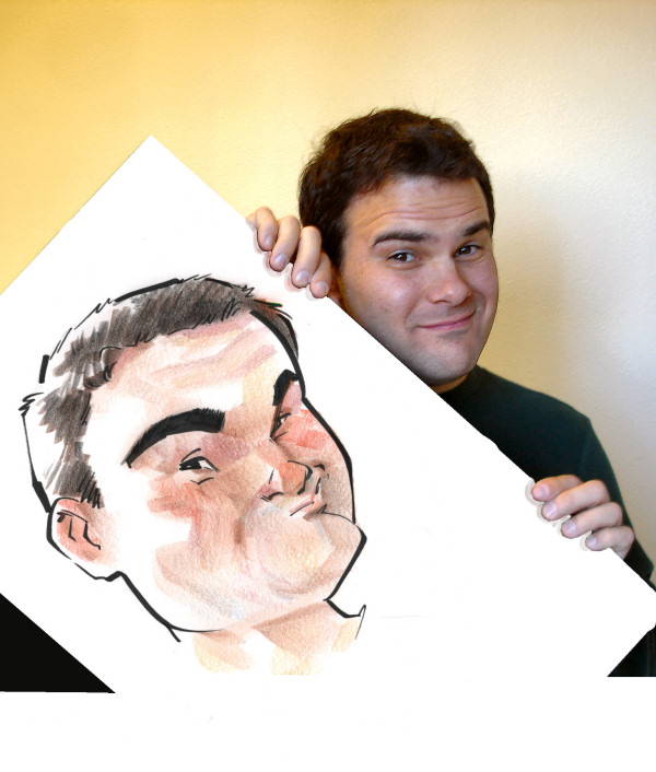 A happy customer holding his caricature
